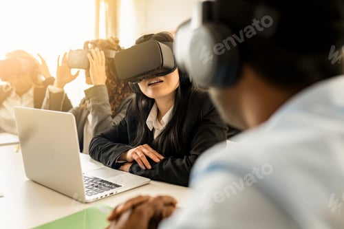 Preview: Multi-ethnic creative business team using virtual reality headsets in meeting in modern office