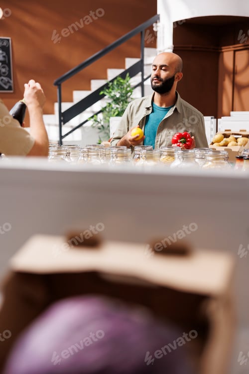 Preview: Man holds a tomato and lemon