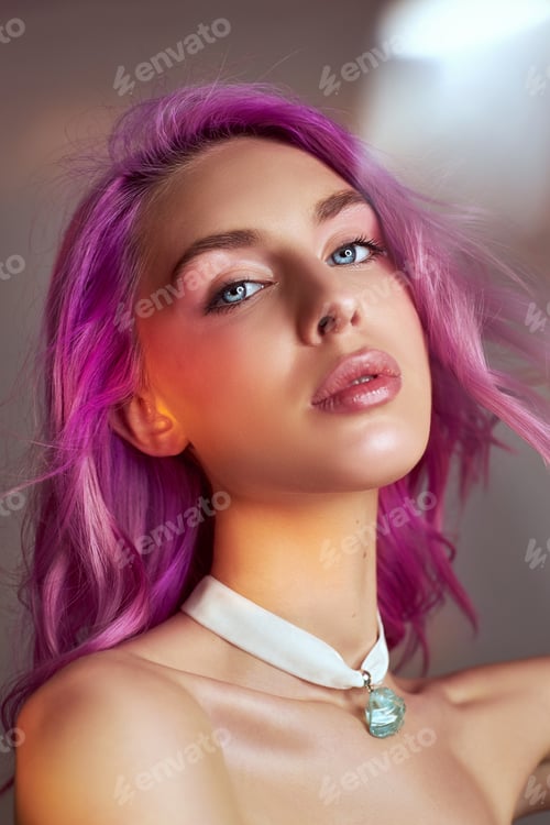 Preview: Portrait of a woman with bright colored flying hair, all shades of purple. Hair coloring, beautiful