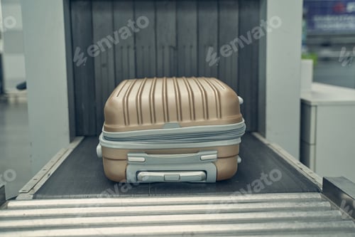 Preview: Close up of suitcase that being under control