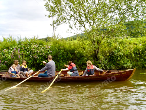 Preview: Family members raffling a boat in a lake