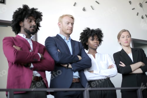 Preview: Group of successful diverse business partners having a business meeting in a modern office
