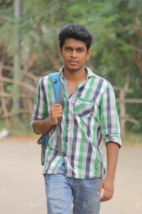Preview: Medium-long shot of an ethnic Indian boy wearing casual clothes, backpack, and moving forward.