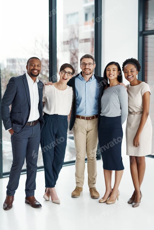 Preview: Portrait of a diverse team of professionals standing together in an office