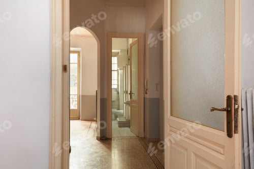 Preview: Old apartment interior view with open wooden door