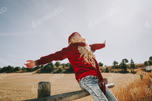Preview: Happy young woman enjoying a sunny day