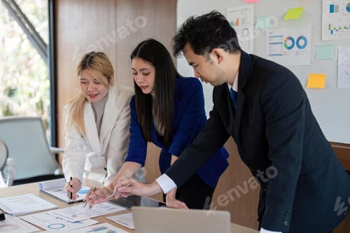 Preview: Diverse business team collaborating on financial strategy in a modern office setting.