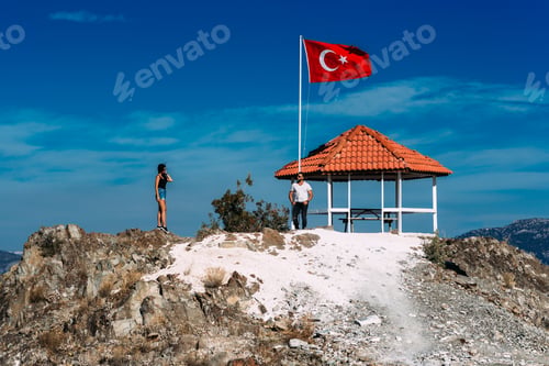 Preview: Boy and girl standing on a rock. A couple in love travels. A couple in Turkey. Man and woman.