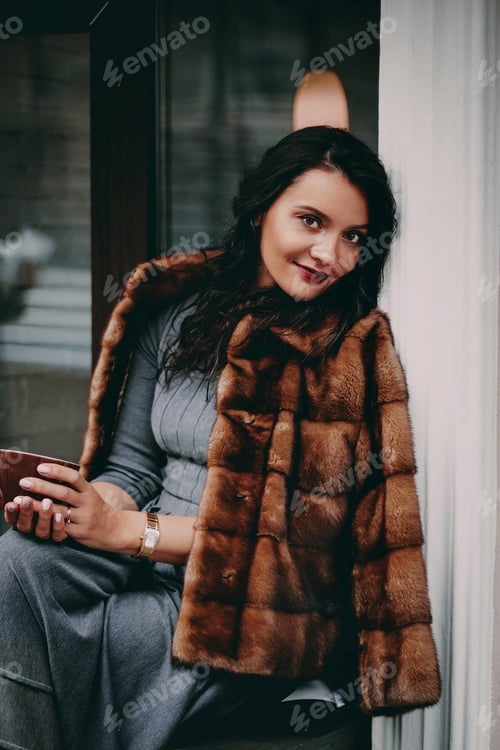 Preview: Elegant Woman in Fur Coat Holding Coffee Cup