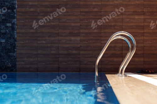 Preview: Swimming pool with stairs and blue water