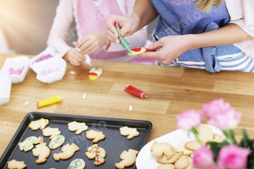 Preview: Mother and daughter preparing cookies in the kitchen