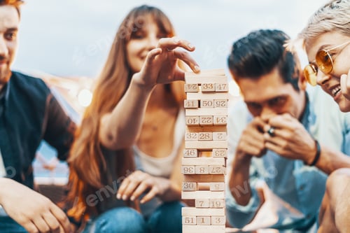 Preview: The company of young people playing jenga