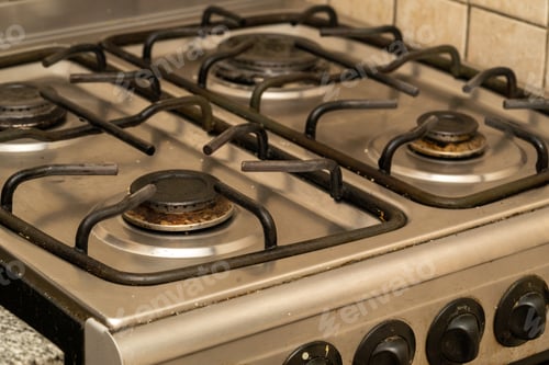 Preview: Closeup shot of a dirty gas stove in the kitchen