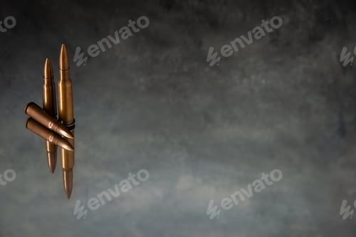 Preview: front view of brown bullets on the gray background gun tank death war shooting