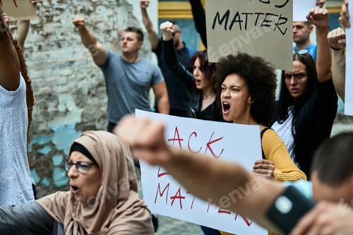 Preview: Multi-ethnic crowd of people protesting against racism public demonstrations.