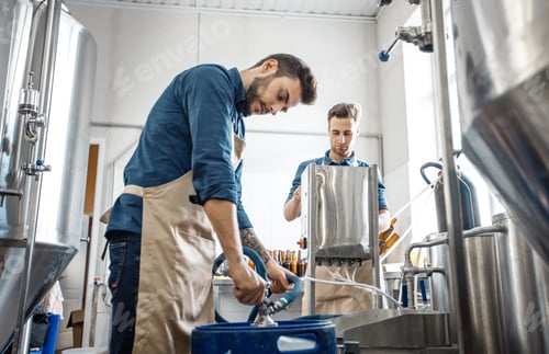 Preview: Plant workers operate equipment on productions of craft drink and modern plant