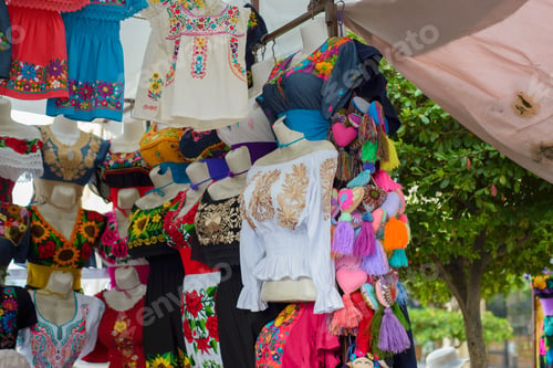 Preview: Traditional Mexican clothing with handmade embroidery. Stall in a market in Mexico.