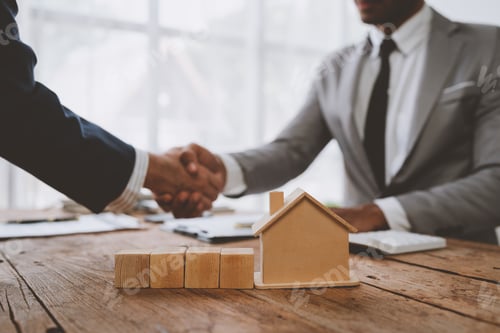 Preview: Real estate broker and client shaking hands after signing sale contract, home loan and congratulatin