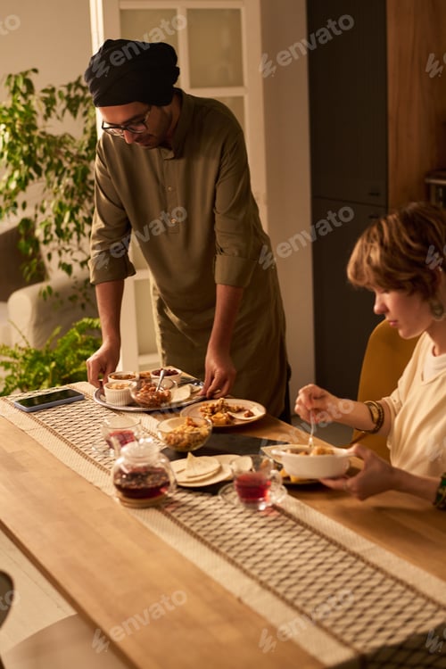 Preview: Enjoying Evening Meal with Close Friend at Home