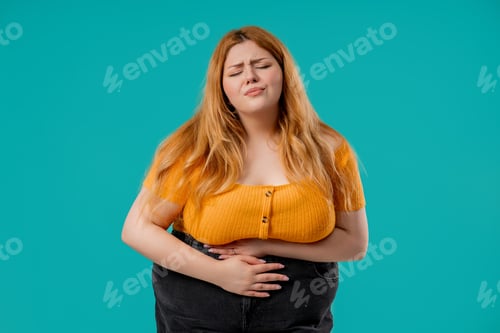 Preview: Plus Size Woman Squeezing Belly With Hands. Abdominal Pain, Suffering Stomach