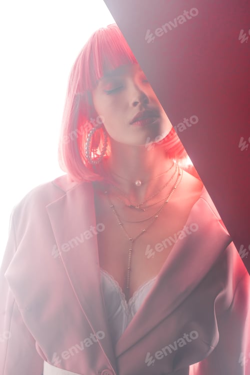 Preview: beautiful young woman with closed eyes on white and pink