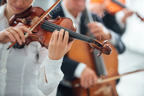 Preview: Violinist performing with orchestra