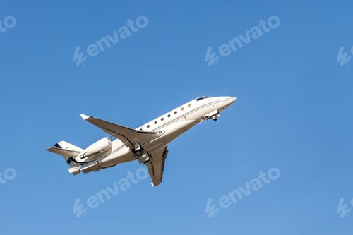 Preview: Scenic close bottom view modern luxury expensive white private jet plane dispatching from airport