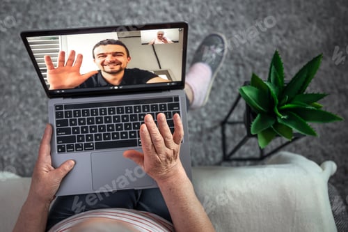 Preview: An old woman communicates with her son via video link through a laptop.