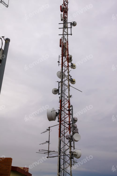 Preview: Vertical shot of a microwave antenna with the skies in the background