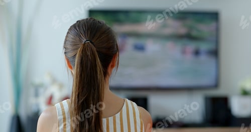 Preview: Woman watch tv at home