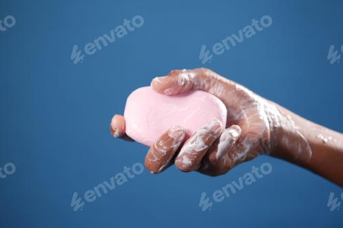Preview: young man washing hands with soap warm water