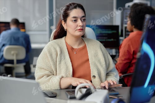 Preview: Young Plus Size Programmer Typing on Keyboard Fixing Errors