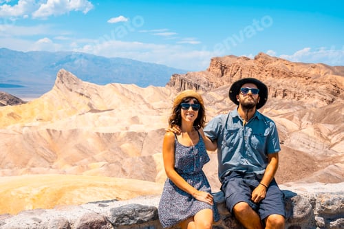 Preview: A young couple in dress on the beautiful viewpoint of Zabriskie Point, California