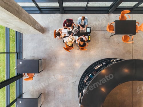 Preview: Young people studying together at public library