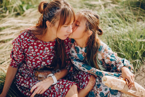 Preview: Cute and stylish family in a summer field