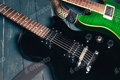 Preview: Electric guitar body and neck detail on wooden background