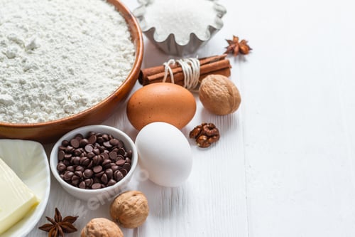 Preview: Ingredients for baking. Selection for cookies or muffins with chocolate drops, selective focus