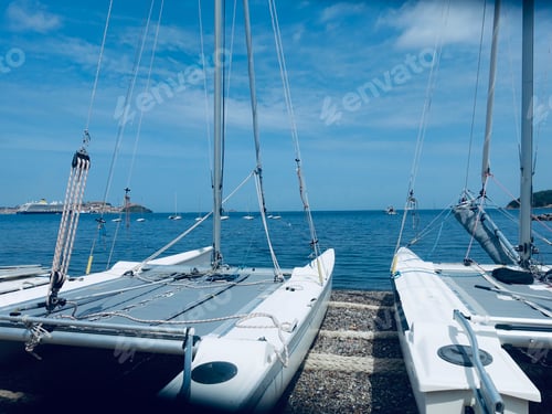 Preview: Sailboats docked at beach on the water's edge