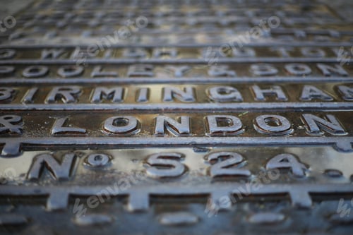 Preview: Selective focus shot of the writing "London" on a steel plate