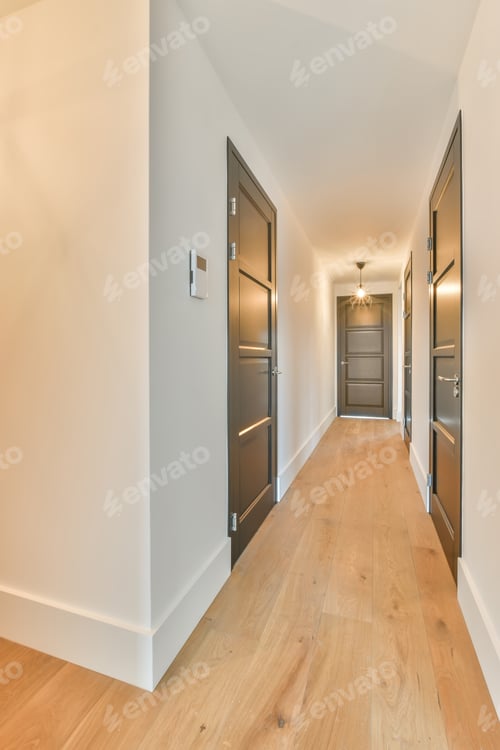 Preview: A long straight corridor with many wooden doors