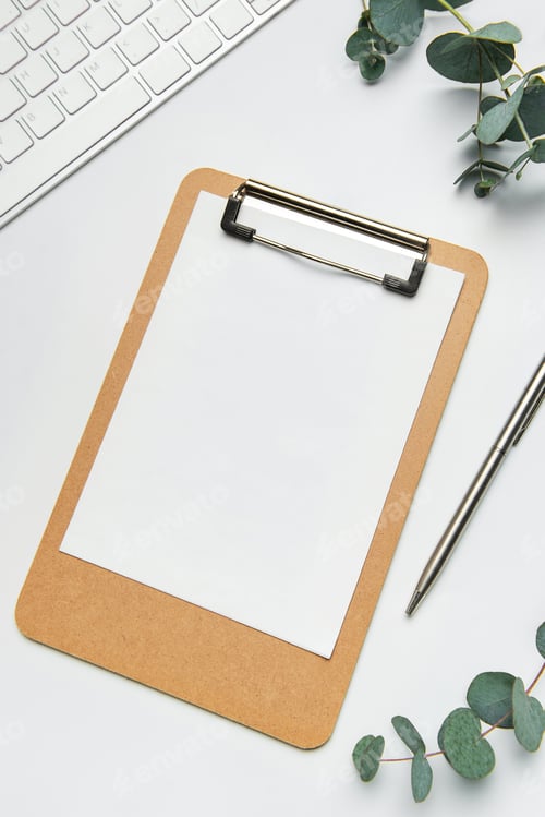 Preview: Clipboard with blank paper, pen, keyboard and eucalyptus branches