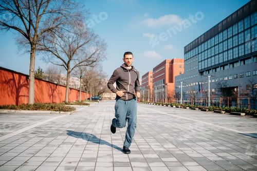 Preview: young man running outdoor training in the city