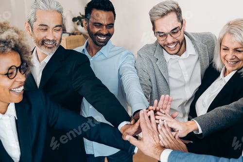 Preview: Multiracial business people celebrate together stacking hands in modern office - Focus on asian ma