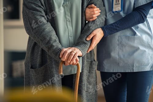 Preview: Nurse assisting senior with walking cane
