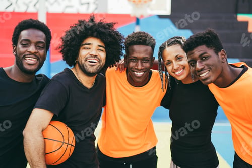 Preview: African friends playing basketball outdoor - Urban lifestyle concept - Focus on center guy face