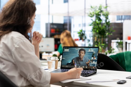 Preview: HR specialist in teleconference meeting on laptop with job candidate