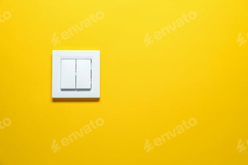 Preview: Modern plastic light switch on orange background. Space for text