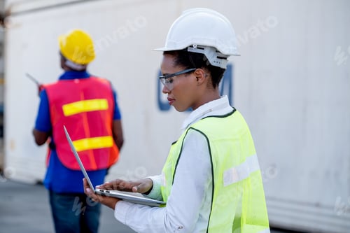 Preview: American African technician worker woman touch and look to laptop