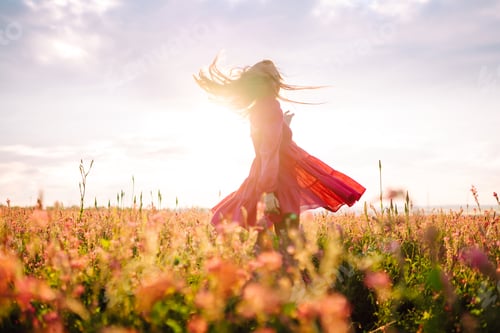 Preview: Happy woman in the blooming field. Nature, vacation, relax and lifestyle. Summer landscape.