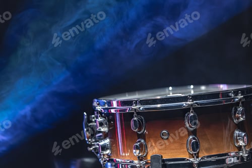 Preview: Close-up of a snare drum on a dark background with smoke, copy space.